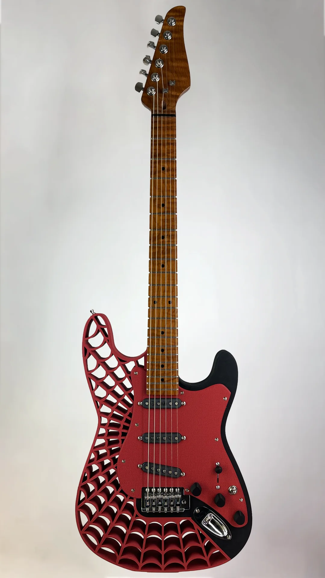 Red 3D-printed guitar with a web-pattern body and roasted maple neck